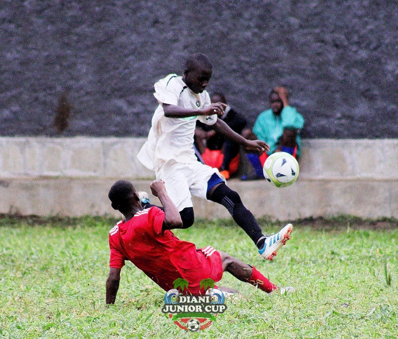 Two youth footballers challenging for a high ball at DJC.