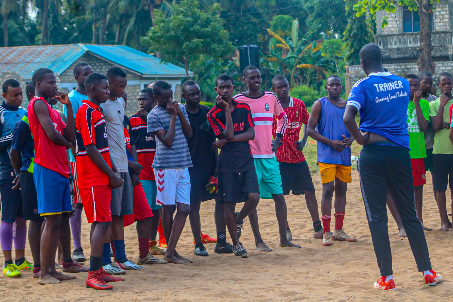 Bambini players gathering as football becomes a meeting point for community hope.